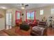 Living room with leather couches, a rug, and a ceiling fan at 240 W Juniper Ave # 1241, Gilbert, AZ 85233