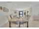 Light and bright dining room with a large wooden table at 8430 E Fairmount Ave, Scottsdale, AZ 85251