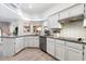 Kitchen with granite countertops and white cabinets at 1036 E Sahuaro Dr, Phoenix, AZ 85020