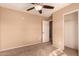 Bedroom with carpet, ceiling fan, and closet at 23200 W Ashleigh Marie Dr, Buckeye, AZ 85326