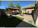 Landscaped backyard oasis with a gazebo and patio at 23200 W Ashleigh Marie Dr, Buckeye, AZ 85326