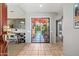 Light and airy entryway with views into the living room and patio at 9707 N 100Th St, Scottsdale, AZ 85258