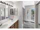Bathroom with double vanity, tile flooring and access to balcony at 1081 W 1St St # 7, Tempe, AZ 85281