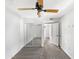 Bedroom with mirrored closet doors and ceiling fan at 1081 W 1St St # 7, Tempe, AZ 85281