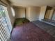 Open living room with carpeted area and a view to another room at 5937 W Coolidge St, Phoenix, AZ 85033