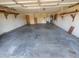 Spacious garage with concrete floor and shelving at 5937 W Coolidge St, Phoenix, AZ 85033