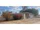 Mid-century modern home with attached garage at 5937 W Coolidge St, Phoenix, AZ 85033