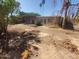 Large backyard with dirt and some sparse vegetation at 5937 W Coolidge St, Phoenix, AZ 85033