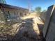 Large backyard with dirt and some sparse vegetation at 5937 W Coolidge St, Phoenix, AZ 85033