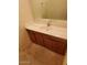 Bathroom vanity with sink and wood cabinets at 5937 W Coolidge St, Phoenix, AZ 85033