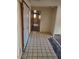Hallway with tiled floor leading to other rooms in the house at 5937 W Coolidge St, Phoenix, AZ 85033