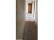 Long hallway with tiled floors and access to bedrooms at 5937 W Coolidge St, Phoenix, AZ 85033