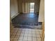 Living room with tiled flooring and a view of the backyard at 5937 W Coolidge St, Phoenix, AZ 85033