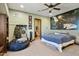 Spacious bedroom with Star Wars mural, built-in shelves, and ensuite bathroom at 35425 N 37Th St, Cave Creek, AZ 85331