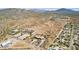 Aerial view showcasing a large property with desert landscape and nearby homes at 35425 N 37Th St, Cave Creek, AZ 85331