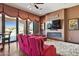 Home theater with plush seating, fireplace, and views of the backyard at 35425 N 37Th St, Cave Creek, AZ 85331