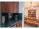 Well-equipped kitchenette with coffee maker and view of dining area at 18459 W Carol W Ave, Waddell, AZ 85355