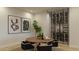 Elegant dining area with a round table, wine storage, and modern chairs at 18720 N 101St St # 2016, Scottsdale, AZ 85255