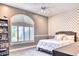 Charming bedroom with an arched window and unique wall decor at 7101 E Berneil Ln, Paradise Valley, AZ 85253