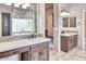 Large bathroom with double sinks and a window overlooking the backyard at 7101 E Berneil Ln, Paradise Valley, AZ 85253