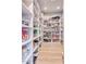 Large walk-in pantry with ample shelving for storage at 7101 E Berneil Ln, Paradise Valley, AZ 85253