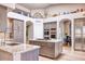 Spacious kitchen with island, double ovens, and stainless steel appliances at 7101 E Berneil Ln, Paradise Valley, AZ 85253