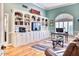 Spacious library with built-in shelving and hardwood floors at 7101 E Berneil Ln, Paradise Valley, AZ 85253
