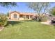 Large backyard with artificial turf and a view of the house at 7101 E Berneil Ln, Paradise Valley, AZ 85253