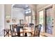Charming dining room with a wooden table and French doors at 7101 E Berneil Ln, Paradise Valley, AZ 85253
