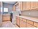 Laundry room with washer, dryer and ample cabinetry at 7101 E Berneil Ln, Paradise Valley, AZ 85253