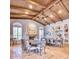 Elegant dining room with large table and wood-beamed ceiling at 7101 E Berneil Ln, Paradise Valley, AZ 85253