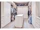 Large walk-in closet with ample shelving and storage space at 7101 E Berneil Ln, Paradise Valley, AZ 85253