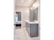 Clean bathroom with gray cabinets and a view into bedroom at 7101 E Berneil Ln, Paradise Valley, AZ 85253