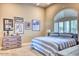 Comfortable bedroom with sports memorabilia and striped bedding at 7101 E Berneil Ln, Paradise Valley, AZ 85253