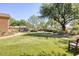 Landscaped backyard with artificial turf and seating at 7101 E Berneil Ln, Paradise Valley, AZ 85253