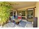 Relaxing patio with wicker furniture and lush greenery at 4525 N 66Th St # 48, Scottsdale, AZ 85251