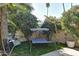 Relaxing patio with a covered daybed and lush landscaping at 4525 N 66Th St # 48, Scottsdale, AZ 85251