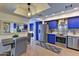 Modern kitchen with blue cabinets and stainless steel appliances at 4525 N 66Th St # 48, Scottsdale, AZ 85251