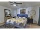 Bright bedroom with a king-size bed, large mirror and eclectic decor at 4525 N 66Th St # 48, Scottsdale, AZ 85251
