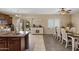 Well-equipped kitchen with an island, ample cabinetry, and breakfast area at 7715 S 69Th Ln, Laveen, AZ 85339