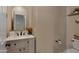 Elegant powder room with a stylish vanity and modern fixtures at 7715 S 69Th Ln, Laveen, AZ 85339