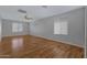 Spacious bedroom with wood flooring and ceiling fan at 7715 S 69Th Ln, Laveen, AZ 85339