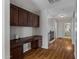 Home office with built-in cabinetry and wood flooring at 7715 S 69Th Ln, Laveen, AZ 85339