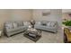 Cozy living room featuring two sofas and a coffee table at 7715 S 69Th Ln, Laveen, AZ 85339