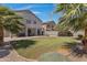 Large backyard with covered patio and grassy area at 7715 S 69Th Ln, Laveen, AZ 85339