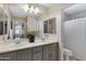 Shared bathroom with double vanity and a shower/tub combo at 7715 S 69Th Ln, Laveen, AZ 85339