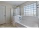 Clean bathroom with a shower and bathtub at 7715 S 69Th Ln, Laveen, AZ 85339