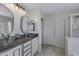 Modern bathroom with granite countertops and glass sinks at 7715 S 69Th Ln, Laveen, AZ 85339