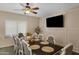 Bright dining room features a large table, seating for eight, and a modern chandelier at 7715 S 69Th Ln, Laveen, AZ 85339