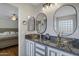Elegant bathroom with double sinks and granite vanity at 7715 S 69Th Ln, Laveen, AZ 85339